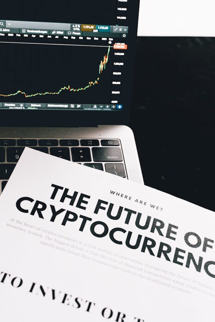 A detailed look at cryptocurrency market trends using a laptop and analytical document.